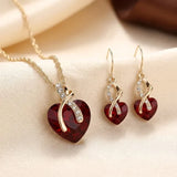 Ensemble de Bijoux Cœur Tordu en Or et Rubis — Doumira
