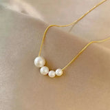 Collier en or avec de jolies perles — Doumira