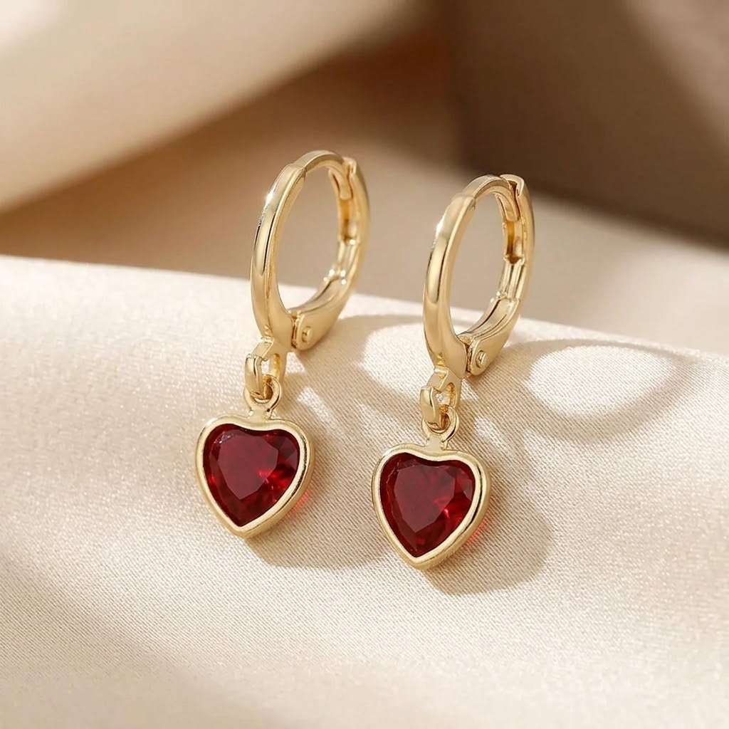 Boucles d'oreilles pendantes en or et rubis en forme de cœur — Doumira